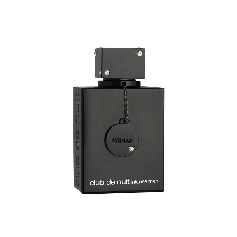 Sophisticated man in a suit wearing Club De Nuit Intense Man fragrance