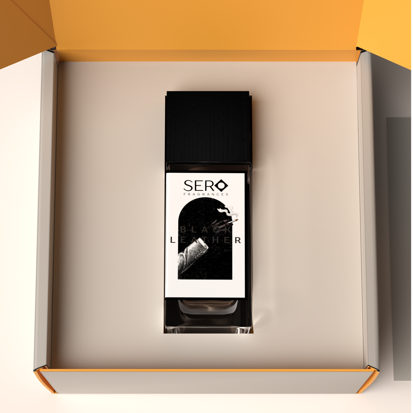 Top view of a packaging within it a minimalist clear glass perfume bottle with black wood cap containing SERO fragrance inspired by TOM FORD's Ombré Leather. 
