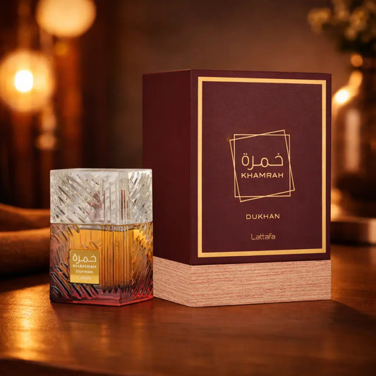 Close-up of Lattafa Khamrah Dukhan bottle showing the "Dukhan" branding and crystal cap
