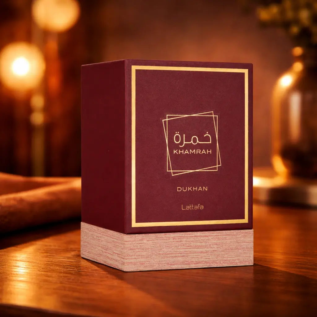  A formal evening setting featuring the golden glow of Khamrah Dukhan perfume