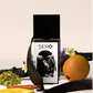Front view of a minimalist clear glass perfume bottle with black wood cap containing SERO fragrance inspired by  Penhaligon's Halfeti Leather. 