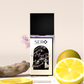 Front view of a minimalist clear glass perfume bottle with black wood cap containing SERO fragrance inspired by LV Symphonie. 