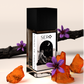 corner view of a minimalist clear glass perfume bottle with black cap containing SERO fragrance inspired by LV Ombre Nomad.