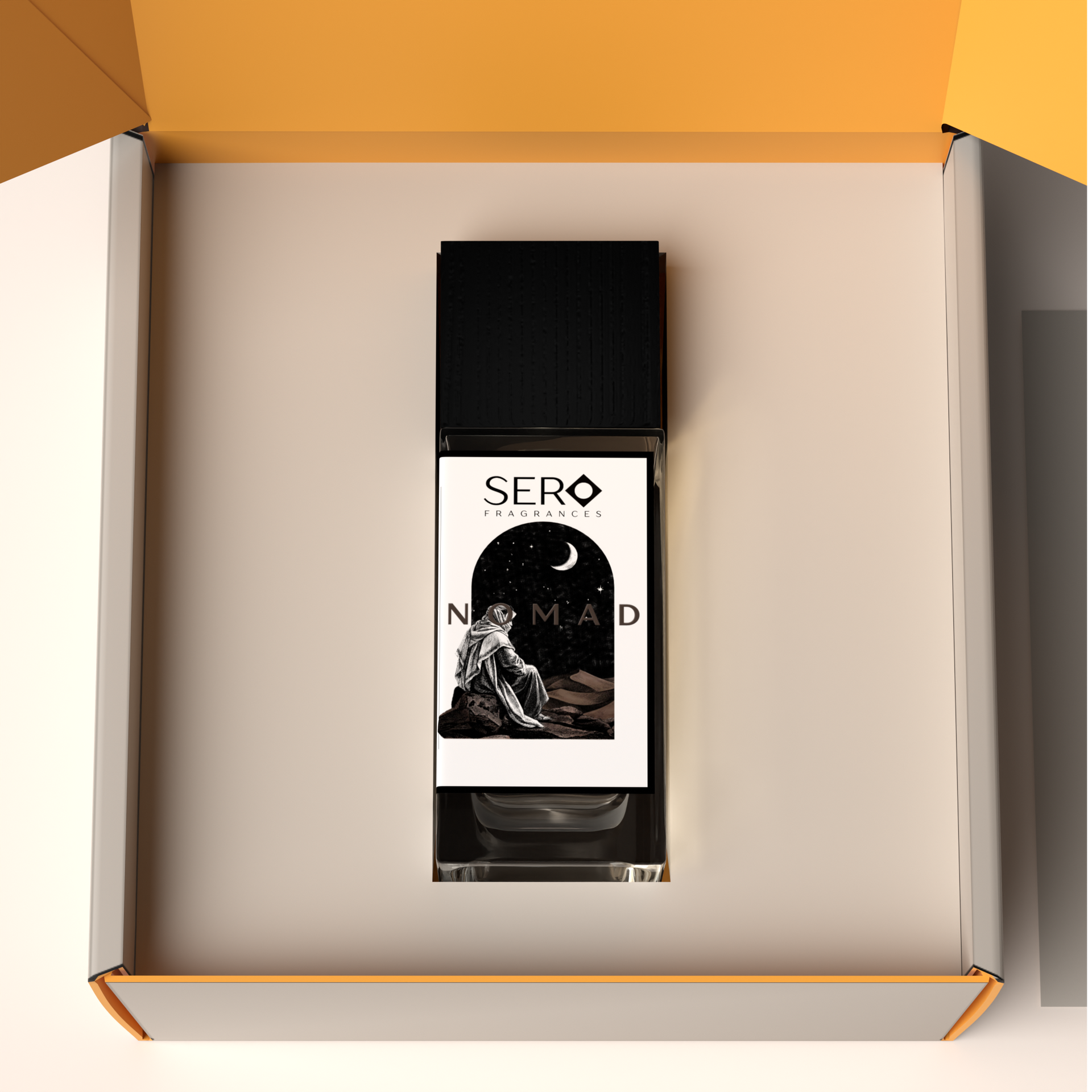 Top view of a packaging within it a minimalist clear glass perfume bottle with black wood cap containing SERO fragrance inspired by LV Ombre Nomad. 