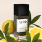 Sero Parfum black bottle with lemons and leaves on a light background